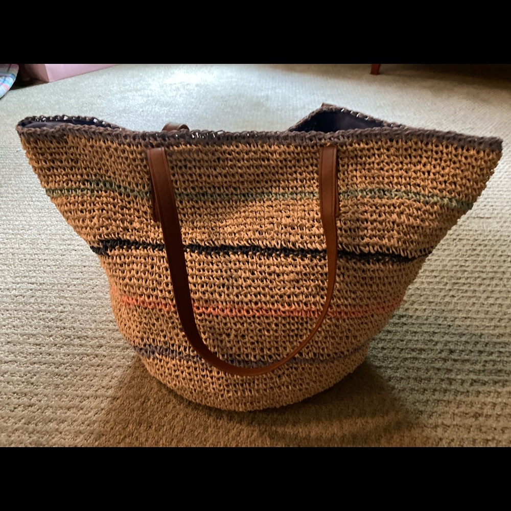 Mia & Tess straw tote with pastel designs woven in against the tan